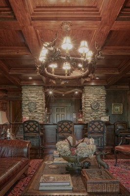 coffered ceilings with wood and stone in lower level