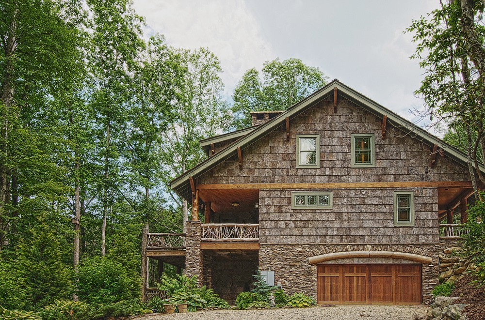 Unique mountain lodge features poplar bark siding