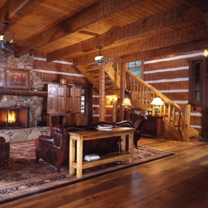 Great room log section with stone fireplace