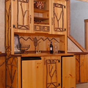 handcrafted wet bar with twig accents built by Mountain Construction near Banner Elk, NC
