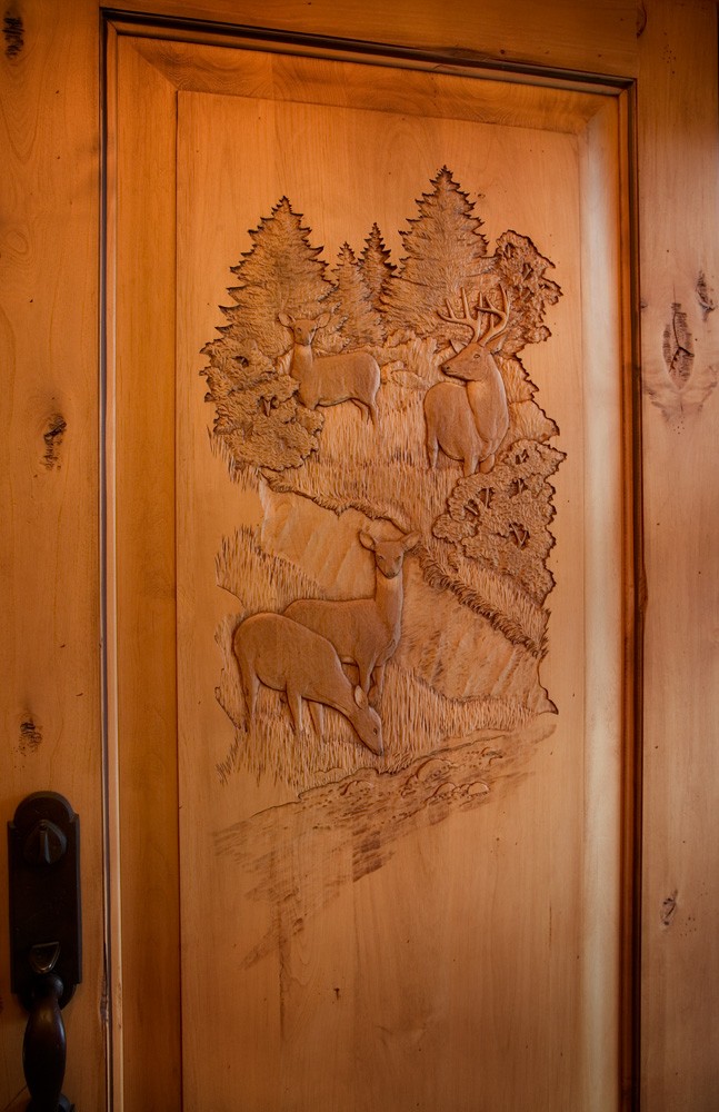 hand carved entry door in tennessee home built by Mountain Construction