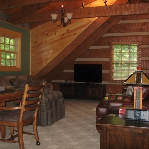 Custom log home in NC mountains designed to blend into the woods