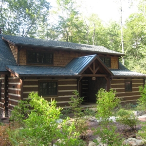 Custom log home in NC mountains designed to blend into the woods