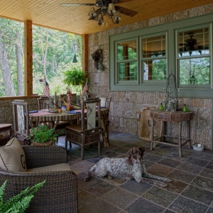 Poplar bark siding, twig railing and stone fireplace