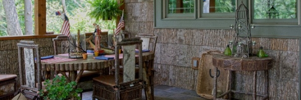 Poplar bark siding, twig railing and stone fireplace