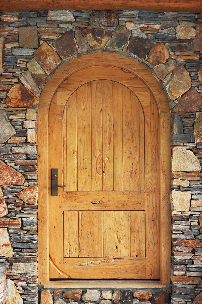 stone porch and wood door in boone nc construction