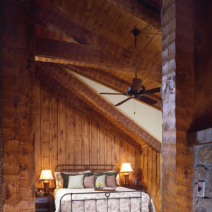 Bedroom in Timber Frame Log Hybrid Lodge Home