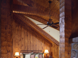 Bedroom in Timber Frame Log Hybrid Lodge Home