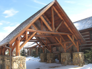 Round log portico at Luxury Estate Home in NC