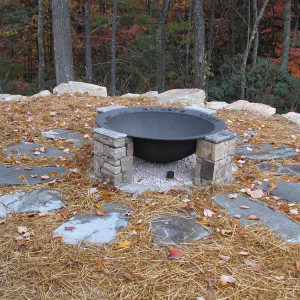 Handcrafted fire pit at family getaway