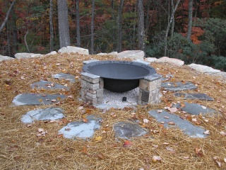 Handcrafted fire pit at family getaway