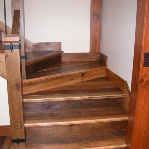 Elegant staircase made from reclaimed lumber