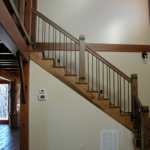 Timber Frame home with stairs of reclaimed wood