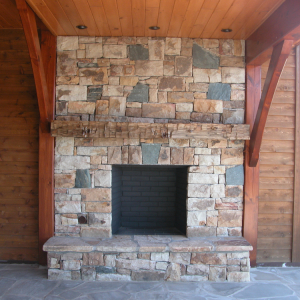 Timber Frame hybrid home with outdoor fireplace